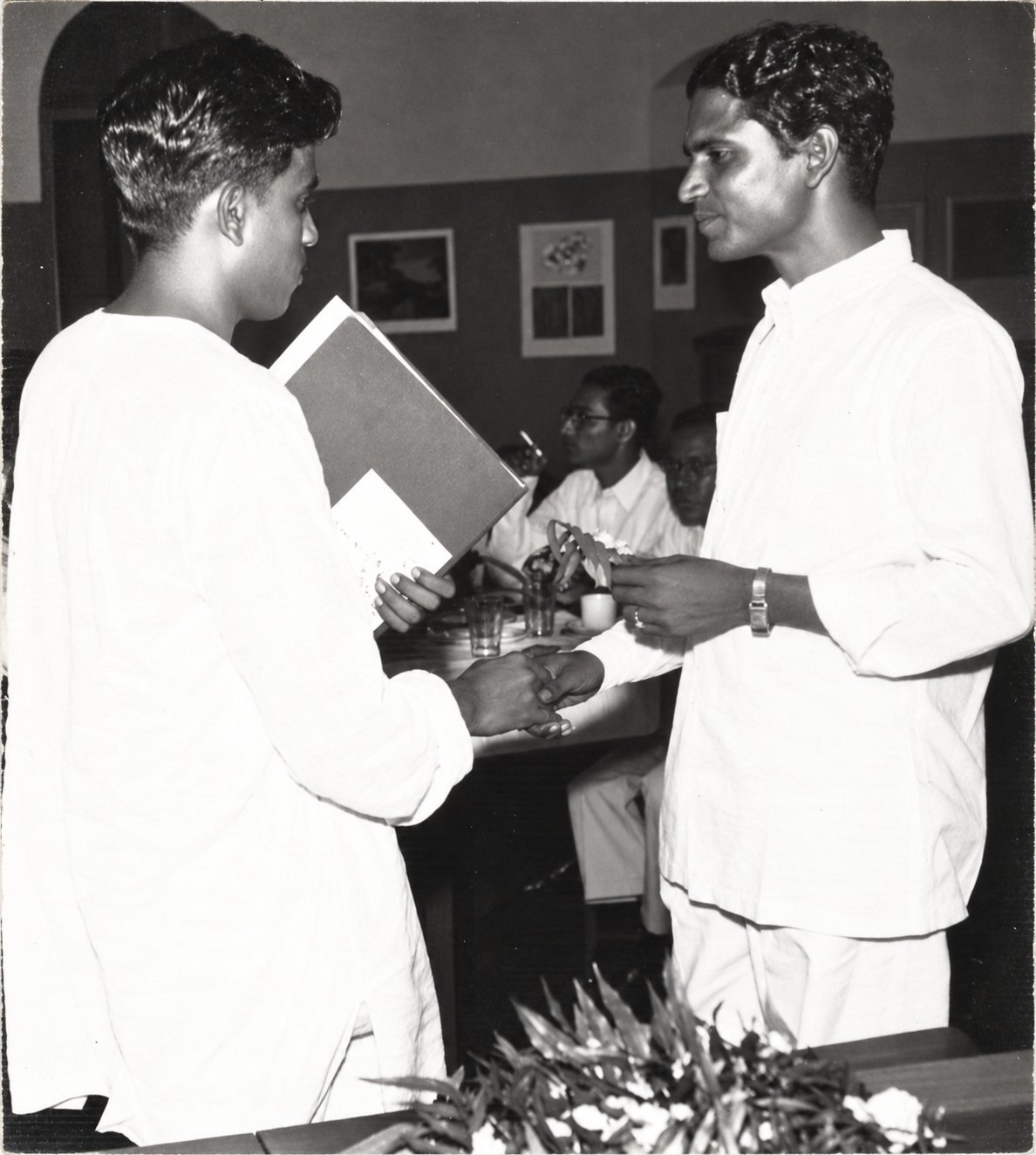 Ancha shaking hands at the exhibition